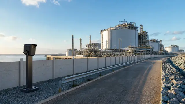 Industrial facility viewed from a safe external perimeter